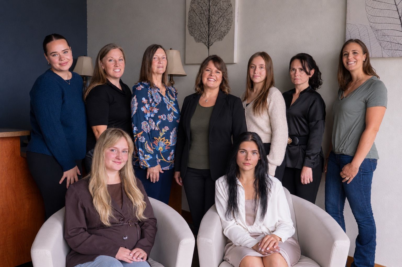 The Spektra Finance team in the Ferndale office, two seated in front and the rest standing behind
